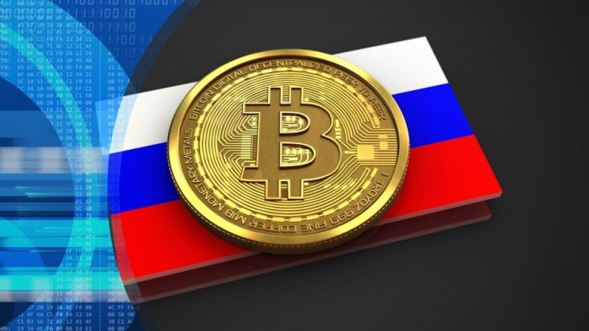 A Bitcoin over a Russian flag