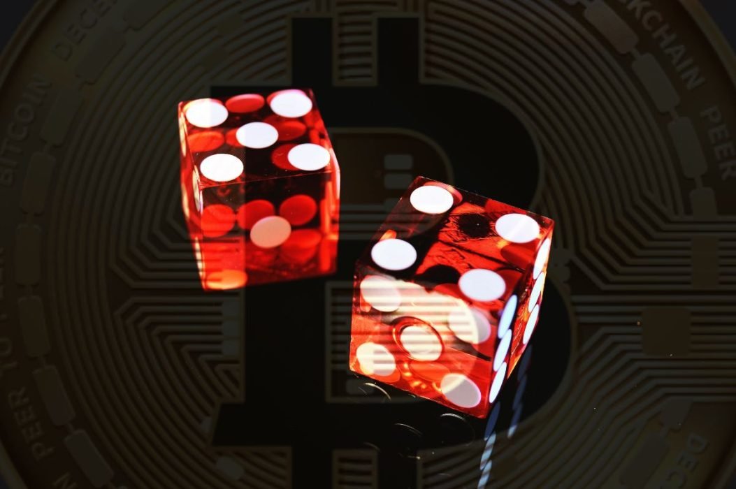 Featured image of the article Best Bitcoin Casinos showing two red dices on a black background