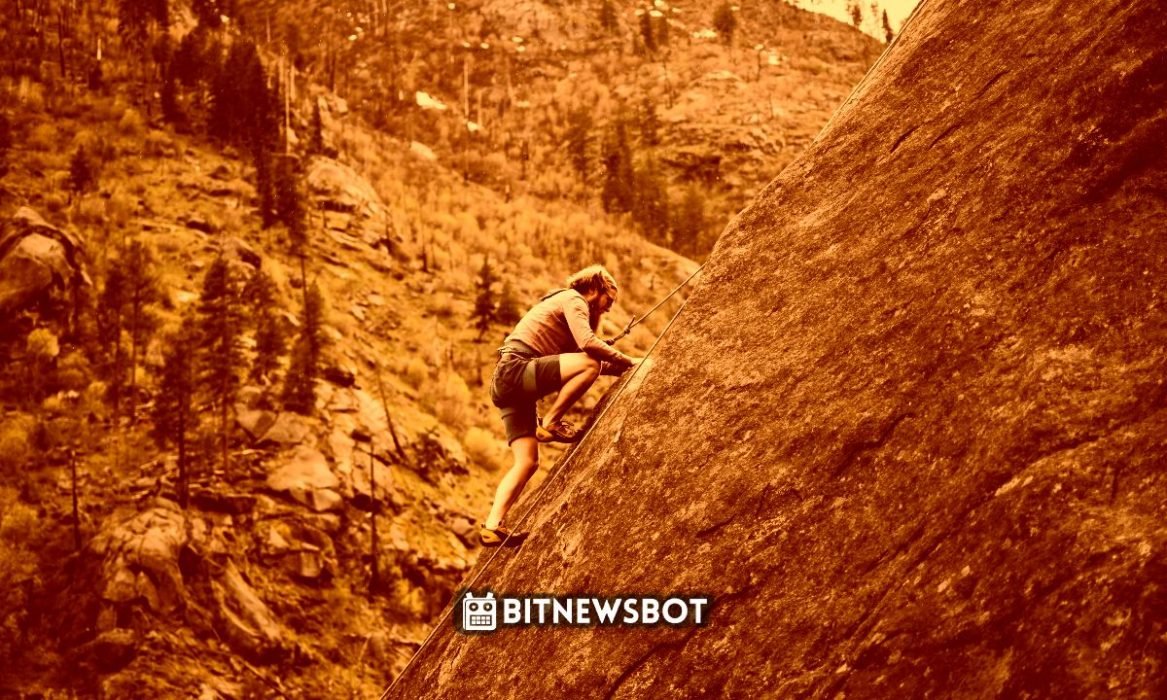 a man is climbing a mountain