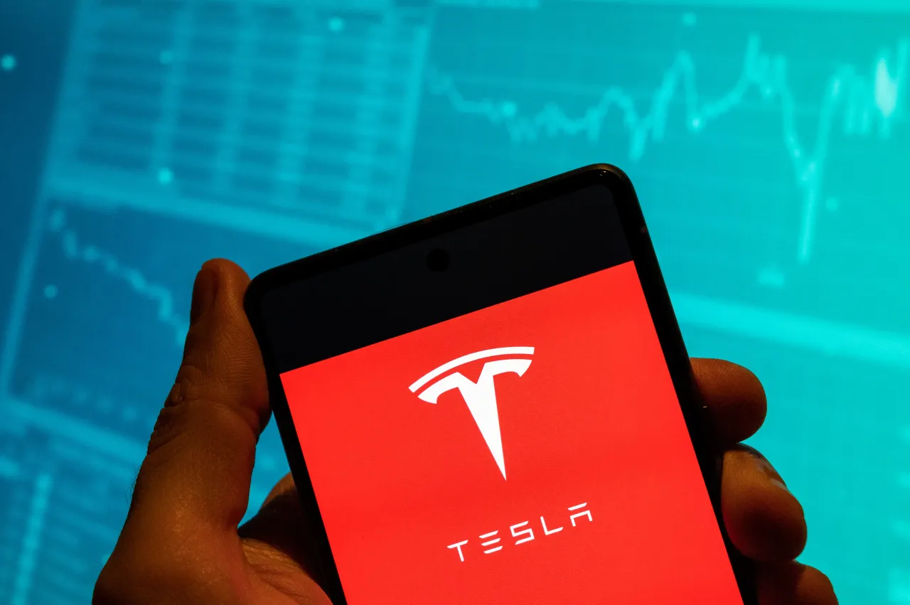 Write a 60 character news title related to The company is preparing for a record investment year focused on Cybercab robotaxis, AI infrastructure and battery supply expansion.Jefferies flagged margin pressure and higher cash burn as key concerns ahead of its Q1 earnings due Wednesday.The brokerage said contributions from robotaxis and humanoid robots are unlikely to support earnings meaningfully until 2027.The results will mark Tesla’s first quarterly update since confirming plans to wind down production of the Model S and Model X.Tesla, Inc. heads into its first-quarter earnings report on Wednesday under pressure, following a 2% drop in the previous session. A Wall Street analyst has trimmed his vehicle delivery estimates ahead of the print and, more worryingly, expects the company to ramp up spending, a combination that could cloud the near-term outlook.Jefferies Sees TSLA Margin Pressure, Rising Cash BurnJefferies raised its price target on TSLA to $350 from $300 while maintaining a ‘Hold’ rating, still implying a 11% downside from current levels. The brokerage expects the EV firm to report about $21.2 billion in first-quarter revenue, a core automotive gross margin of 15.5%, an operating margin below 3%, and GAAP earnings per share (EPS) of $0.14.It also cut its full-year delivery estimate by 3% to 1.7 million vehicles, assuming 50,000 lower-priced vehicles and 25,000 Cybercabs, with most Cybercab costs capitalized. Jefferies also expects capex to rise to $19 billion this year, more than doubling from $9 billion last year, resulting in $4.9 billion in cash burn. The brokerage said meaningful contributions from robotaxis and humanoid robots are unlikely before 2027. Tesla’s company-compiled analyst consensus suggests a similarly modest earnings setup despite improving deliveries. Estimates call for about $21.4 billion in revenue, $541 million in operating income, 2.5% operating margin, and GAAP EPS of $0.16. Analysts also expect negative free cash flow of $1.58 billion for the quarter.The upcoming results will also mark Tesla’s first quarterly earnings release since the company confirmed plans to wind down production of its Model S sedan and Model X SUV, as it shifts factory capacity towards Optimus humanoid robots.Tesla Misses Delivery Estimates AgainTesla delivered 358,023 vehicles in Q1, up from 336,681 units a year earlier after last year’s Model Y transition disrupted production.However, the company produced 408,386 vehicles, leaving output ahead of deliveries by more than 50,000 units, the widest gap in at least four years and a signal investors will likely watch closely for demand absorption.Tesla also missed company-compiled consensus delivery expectations of 365,645 vehicles, marking the second consecutive quarterly miss.TSLA Capex Surge Signals Shift Toward Cybercab, OptimusTesla plans to spend more than $20 billion this year, more than double last year’s $8.5 billion, with most investment directed toward Cybercab production lines, Optimus robots, battery and lithium infrastructure and AI programs rather than its traditional EV lineup.CEO Elon Musk called 2026 “a very big capex year” in its January earnings call, adding that the company is making “big investments for an epic future.” CFO Vaibhav Taneja said the spending would support Cybercab production, the semi-truck program, Optimus robotics, and battery supply infrastructure.Last year, Musk said autonomy is expected to meaningfully affect financial performance around mid-2026, adding that once the impact begins, it could “go exponential from there.”Tesla Regains EV Lead Amid Rising China PressureTesla regained the global battery-electric delivery lead in the latest quarter with 358,023 vehicles, compared with 310,389 for BYD’s battery-electric lineup, after losing its broader global EV sales crown to BYD last year.The setback followed the expiration of the U.S. $7,500 federal EV tax credit, while Chinese competitors continue offering lower-priced alternatives with bundled driver-assistance features.Tesla is also reportedly exploring development of a smaller, lower-cost electric SUV expected to be produced initially in China and later potentially in the U.S. and Europe. The move follows the company’s earlier decision to abandon its planned $25,000 mass-market EV platform in favor of robotaxi development built on the same architecture.How Do Retail Traders Feel About TSLA?On Stocktwits, retail sentiment for TSLA was ‘extremely bullish’ amid ‘high’ message volume.TSLA sentiment and message volume as of April 20 | Source: StocktwitsOne user said, “back over $400 before ER my guess!“Another user said, “imagine if Elon announces a merger between TSLA and SpaceX Wednesday”TSLA stock has risen 63% over the past year.For updates and corrections, email newsroom[at]stocktwits[dot]com.Read Next: LCID Stock Pops After Hours As Uber Loads Up On More SharesSubscribe to Chart ArtThe best trade ideas and analysis from the Stocktwits community. Delivered daily by 8 pm ET.Read about our editorial guidelines and ethics policy.Don't include  tags. IMPORTANT: Your response should contain only the straightforward news title with the specified instruction. Do not include any meta-commentary, explanations, or references to these instructions.